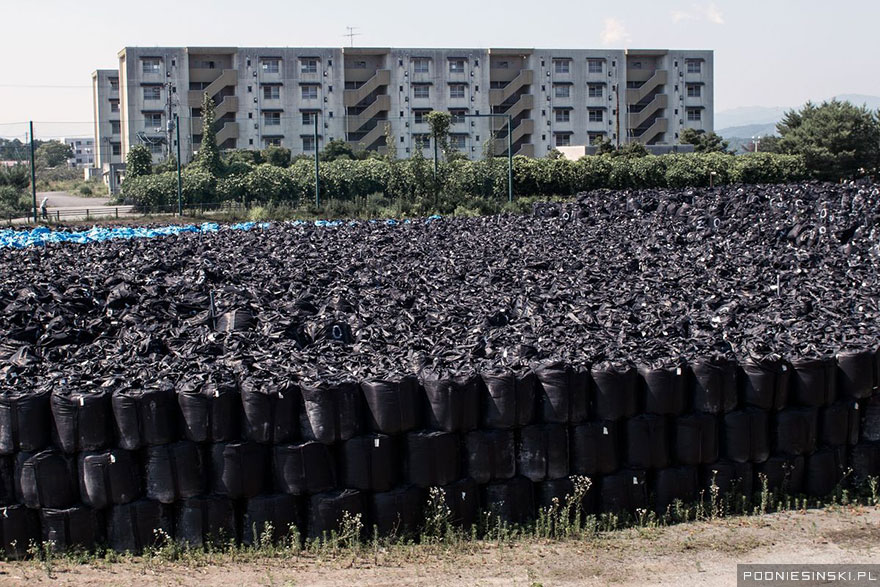 16-Bags of radioactive soil are stacked one on top of the other to save space