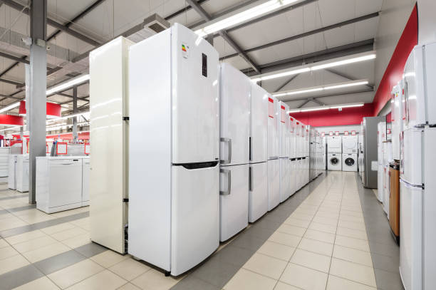 Rows of fridges and washing mashines in appliance store