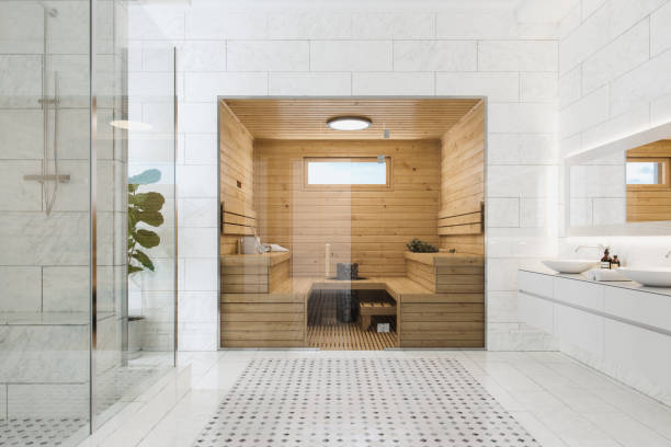 Wooden sauna in a modern luxurious bathroom.