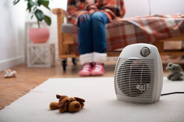 Electric fan heater in the cozy home interior.